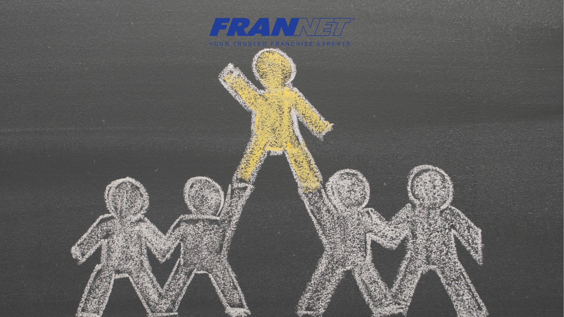Chalk board drawing of a human pyramid with four people on bottom and one on top