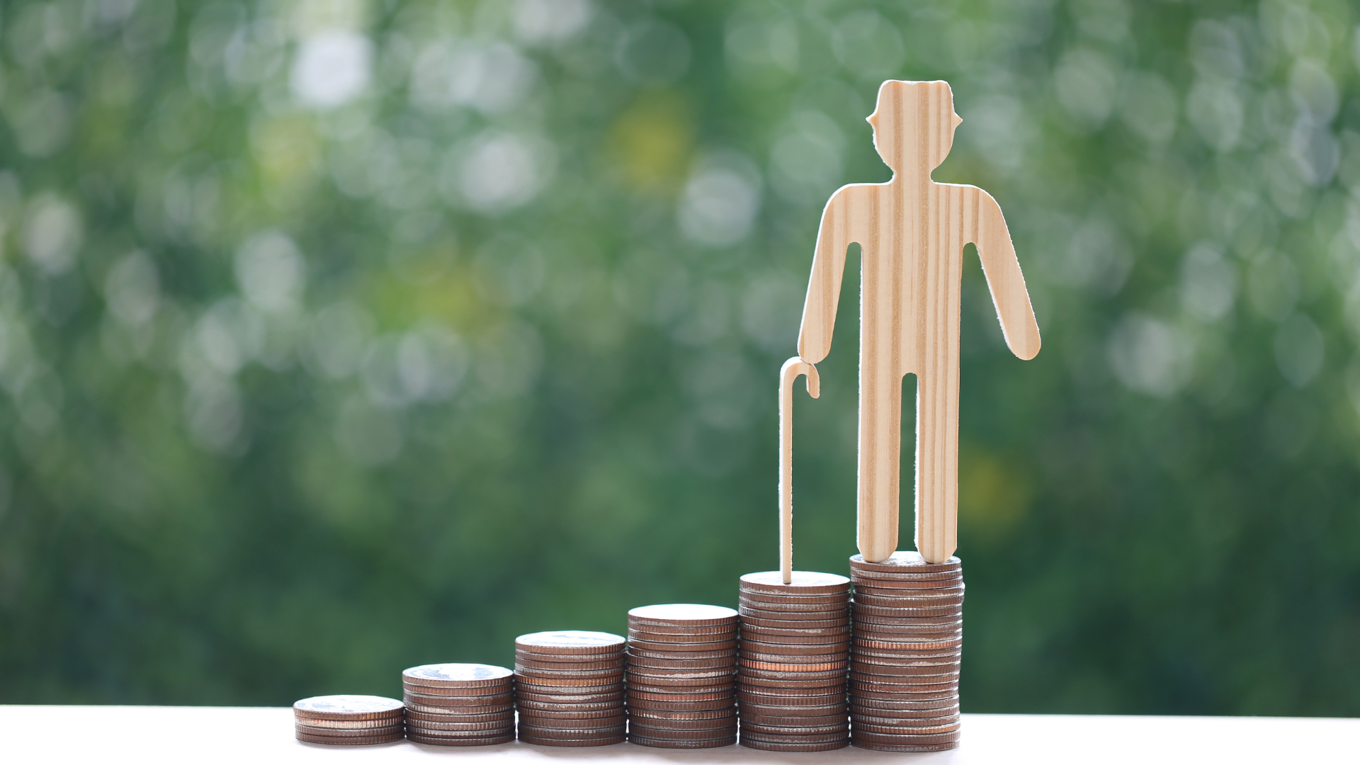 130 Stacks of coins with a wooden character holding a can representing rrsp funds