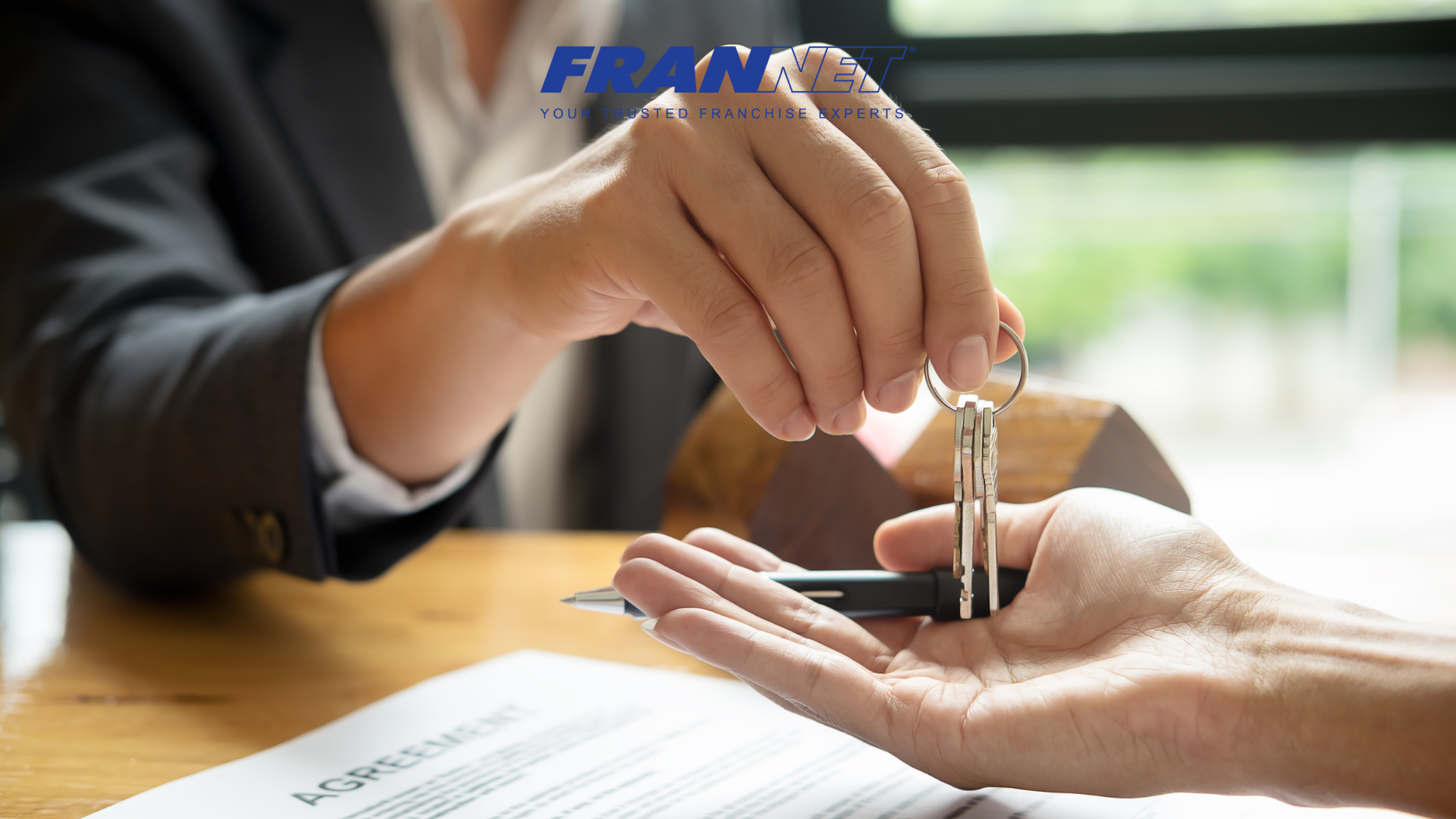 Handing over keys to someone representing a franchise lease negotiation