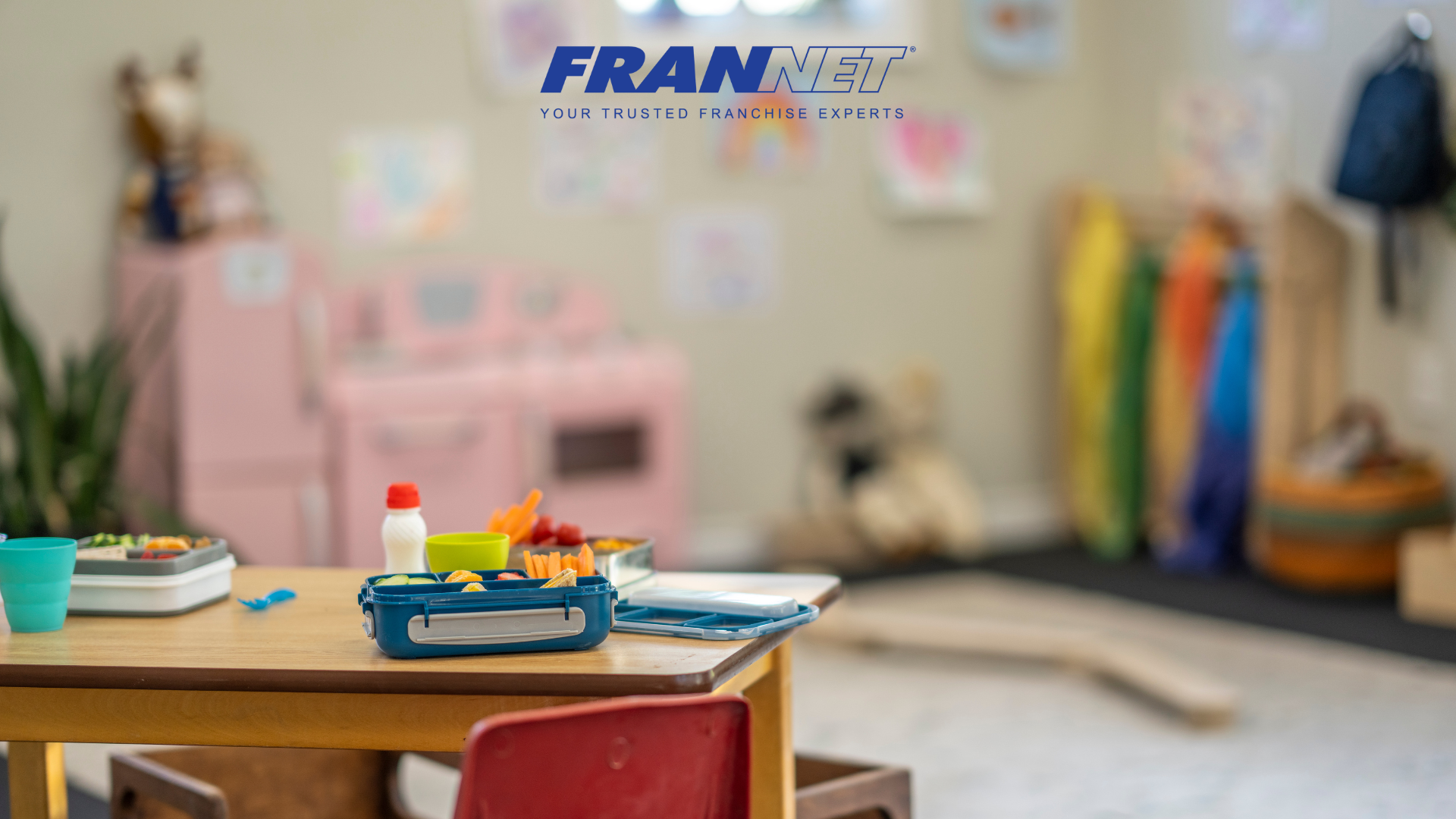 Desk with craft supplies and toys in the background