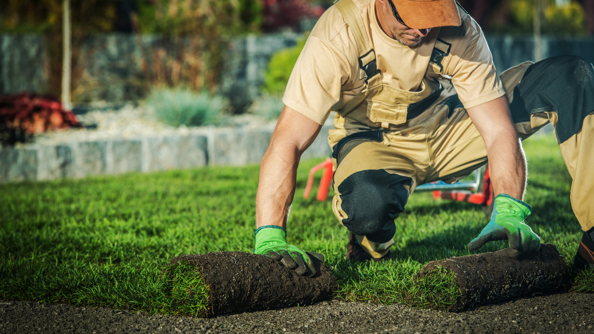 Man rolling out grass representing outdoor franchises