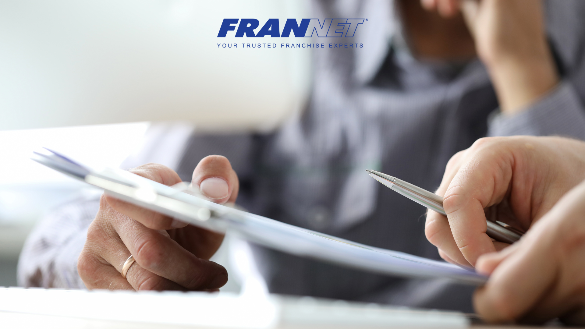 Someone holding documents - representing the need for franchises to file their FDD in franchise registration states